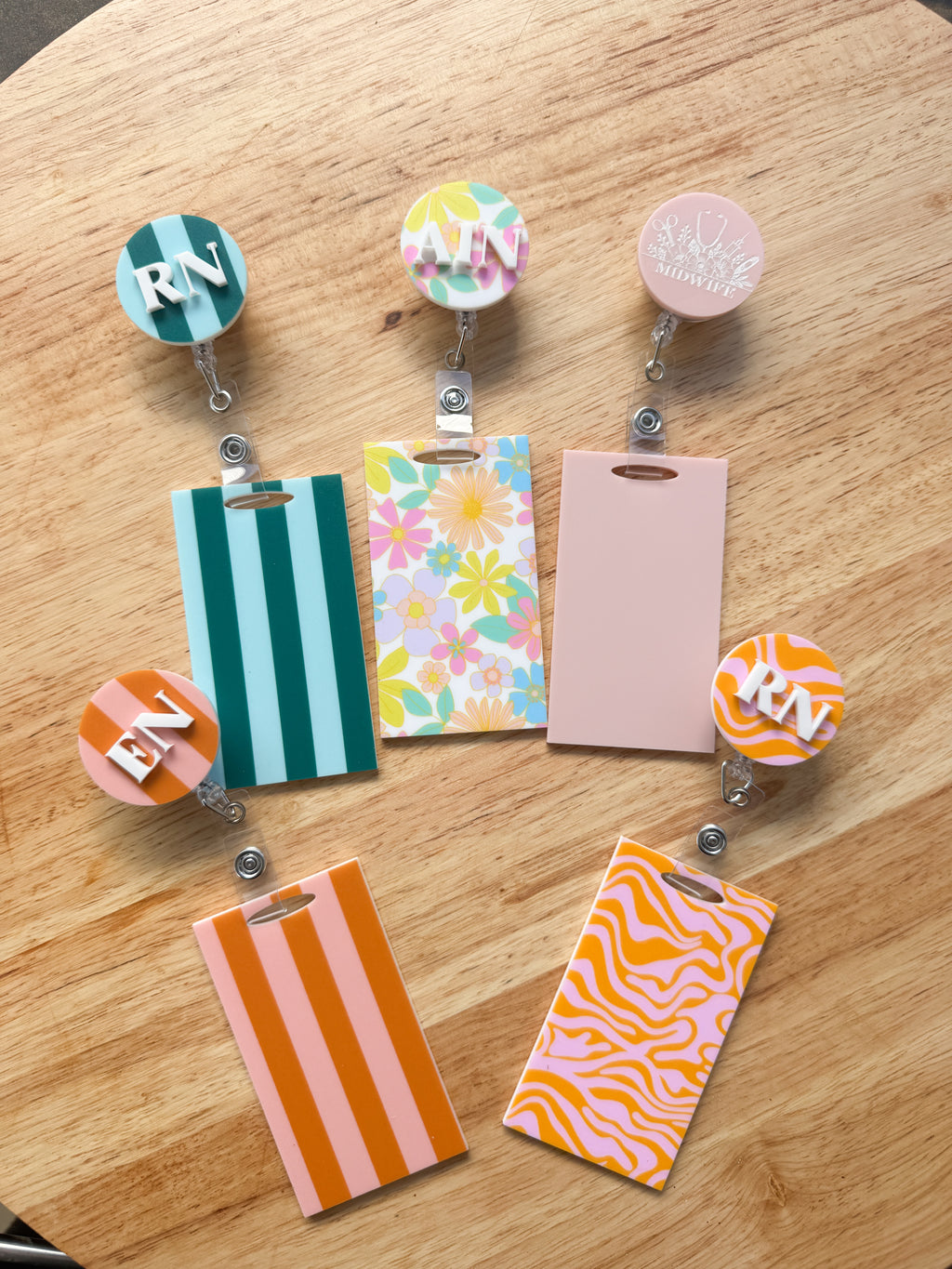 Patterned acrylic badge reel with retractable ID holder, designed for nurses, teachers and everyday workwear.