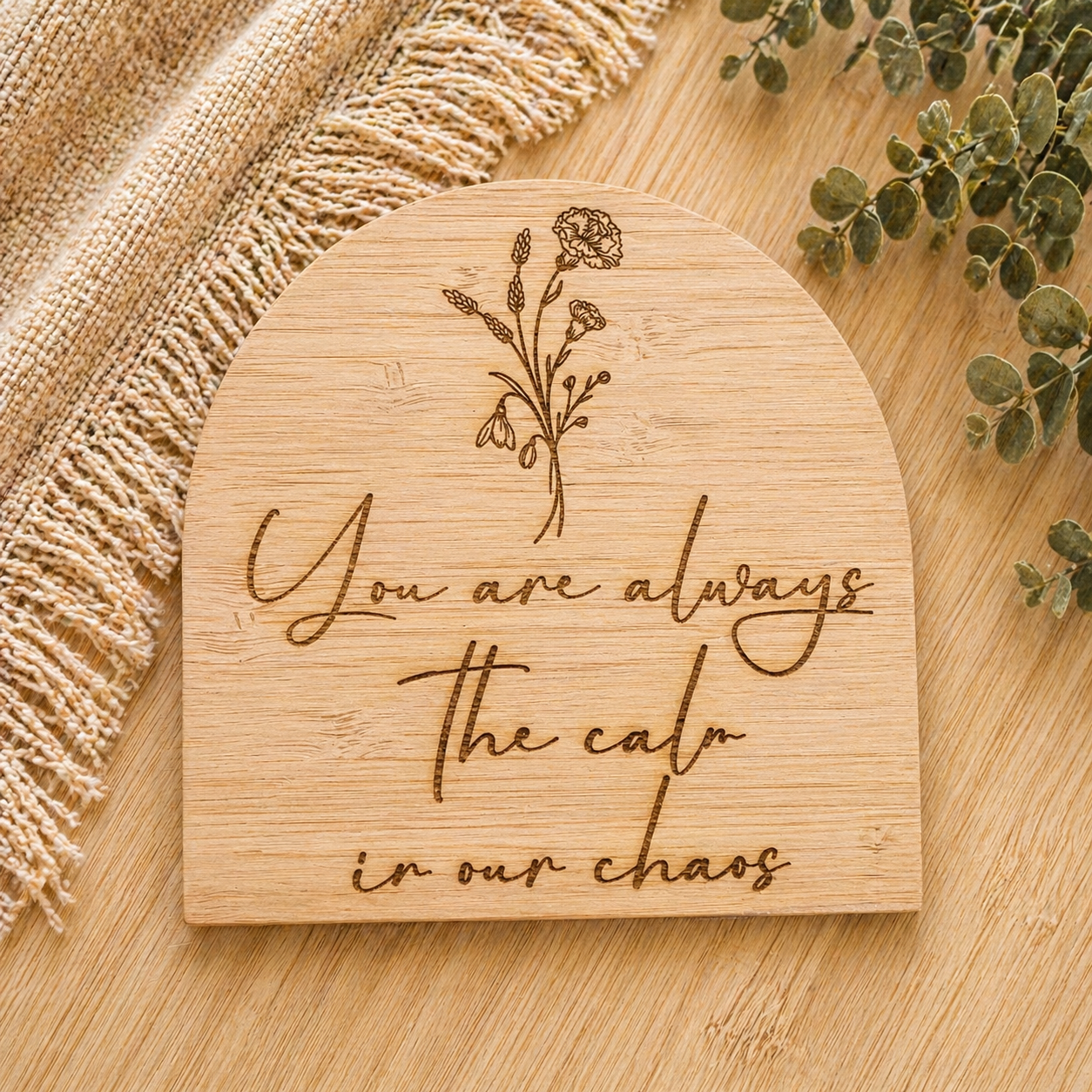 Engraved wooden plaque with quote “you are always the calm in our chaos”, styled as a meaningful gift for mum or family home
