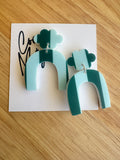 Mist teal arch dangle earrings by Coco and May on display card, lightweight statement acrylic earrings Australia
