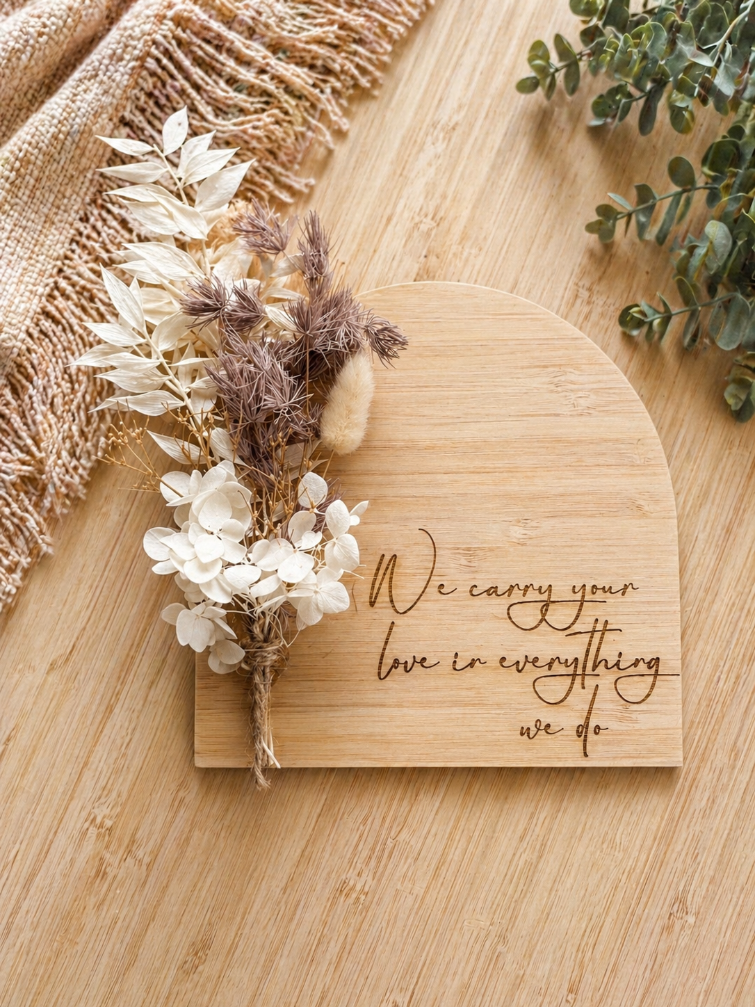 Engraved wooden plaque with quote “carry your love”, styled as a meaningful gift for mum or remembrance keepsake

