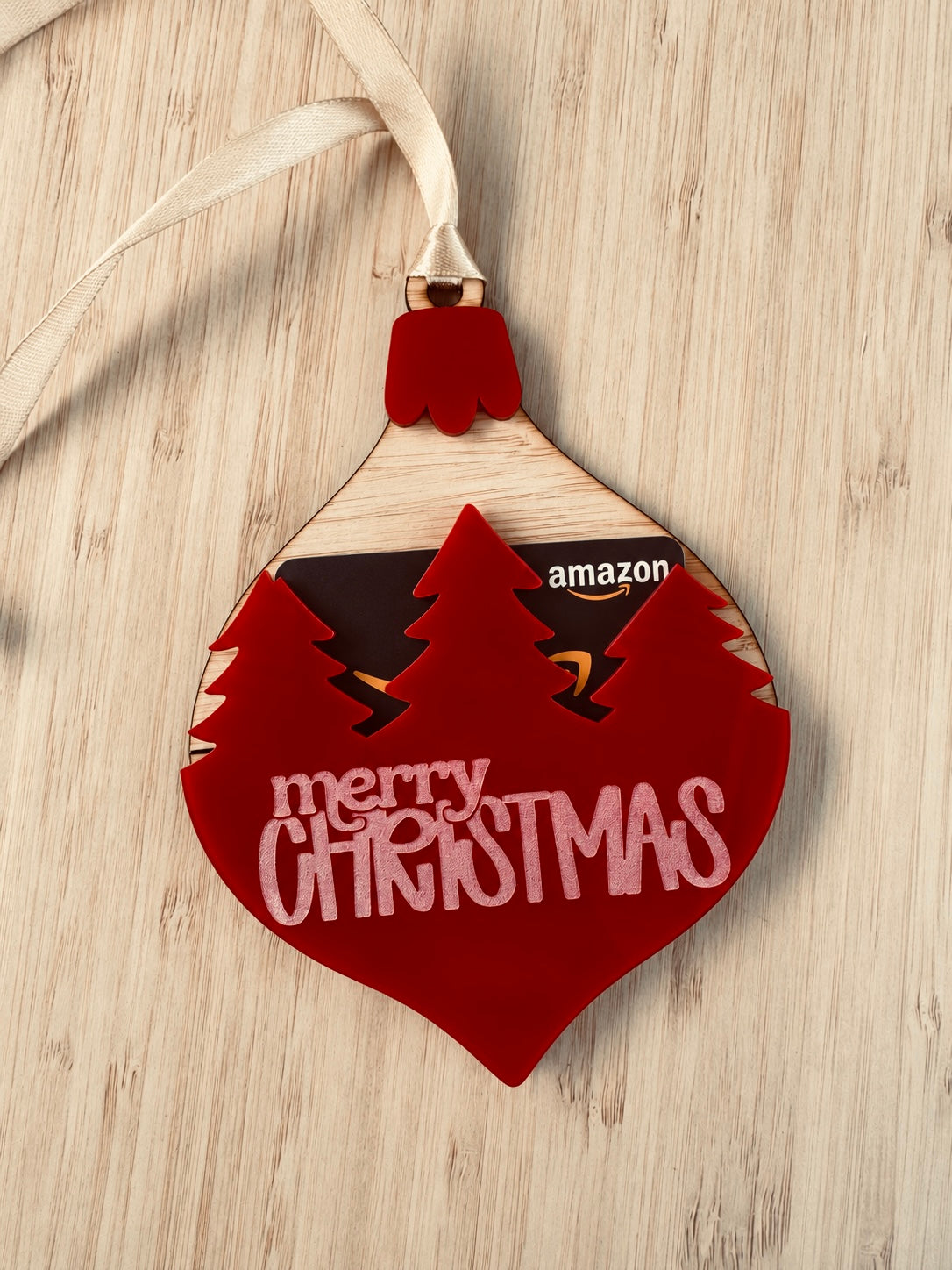Red Christmas bauble gift card holder with festive Merry Christmas lettering, Christmas tree details and hanging ribbon by Coco & May