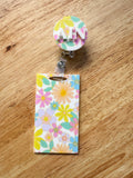 Patterned acrylic badge reel with retractable ID holder, designed for nurses, teachers and everyday workwear.