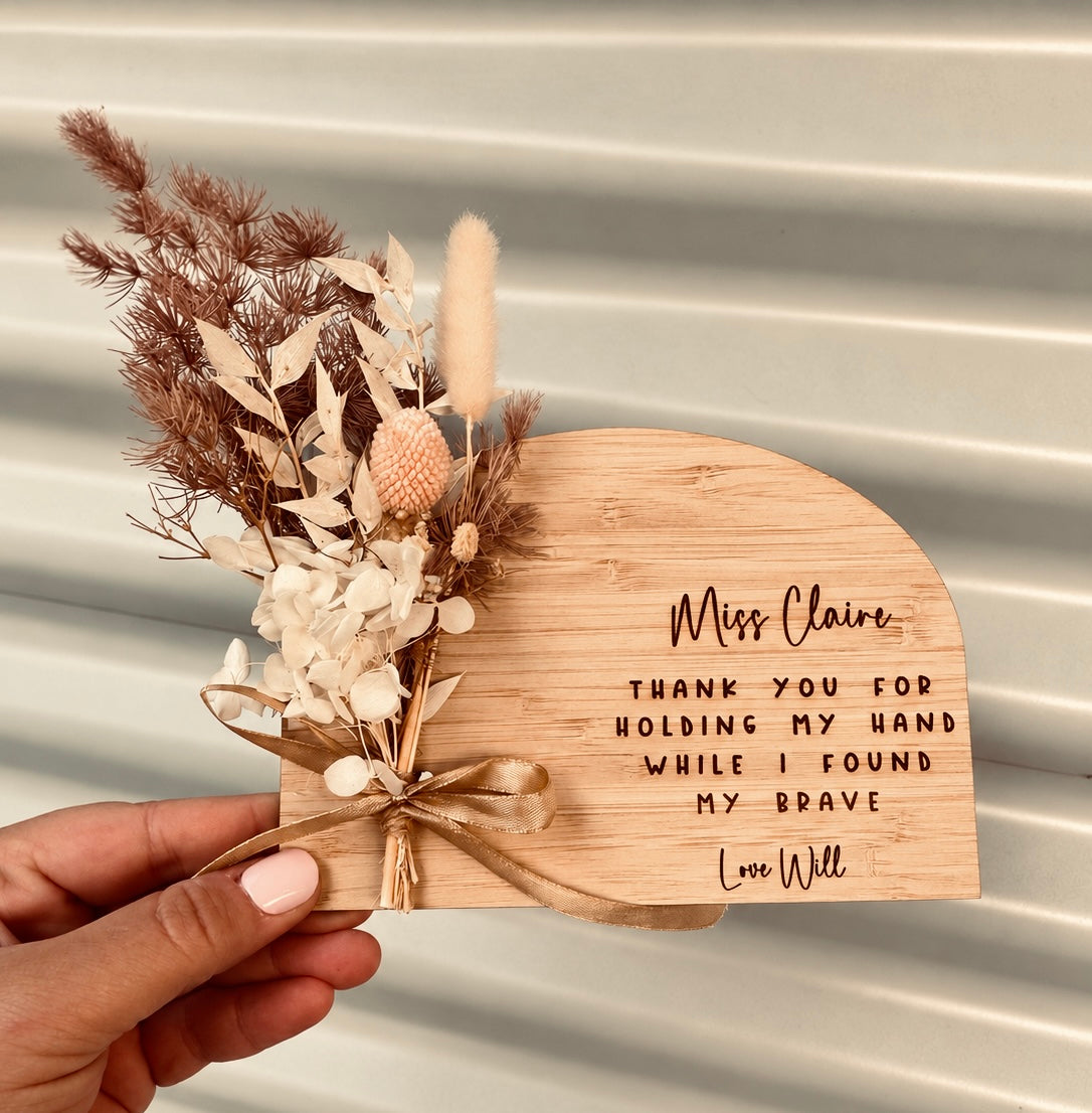 Personalised natural wooden teacher plaque with engraved appreciation message and arrangement of dried flowers in soft neutral tones, by Coco & May