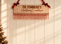 Personalised Coco & May wooden candy cane Christmas countdown with family name and red ribbon