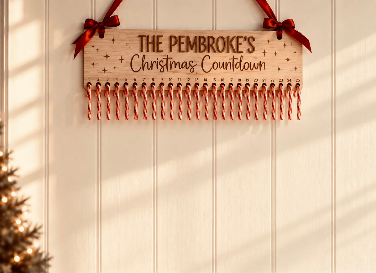 Personalised Coco & May wooden candy cane Christmas countdown with family name and red ribbon