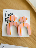 Birdie arch dangle earrings by Coco and May on display card, lightweight statement acrylic earrings Australia
