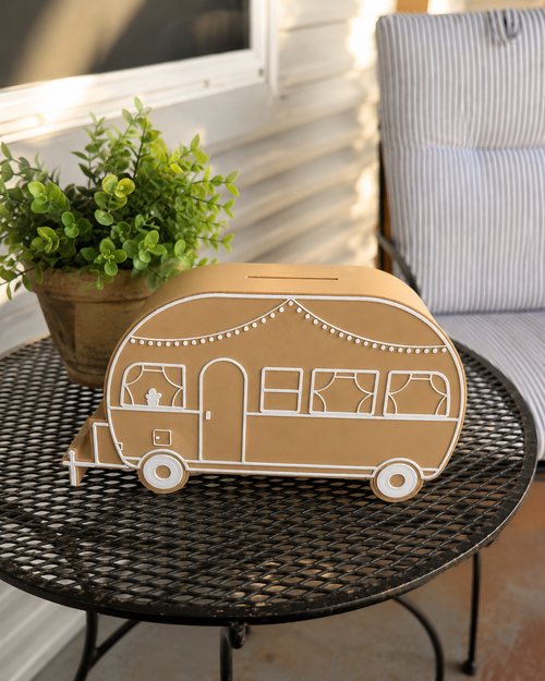 Caravan-shaped holiday savings money box by Coco & May, perfect for saving for family holidays, camping trips and caravan adventures.