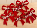 Coco & May personalised red bow Christmas ornaments with pink mirror names
