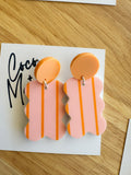 Goldie striped orange and peach dangle earrings by Coco and May on display card, lightweight statement acrylic earrings Australia

