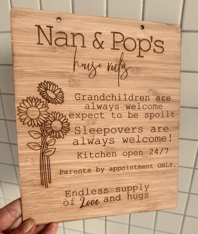 Wooden plaque engraved with 'Nan & Pop’s House Rules – Grandchildren always welcome and spoilt.