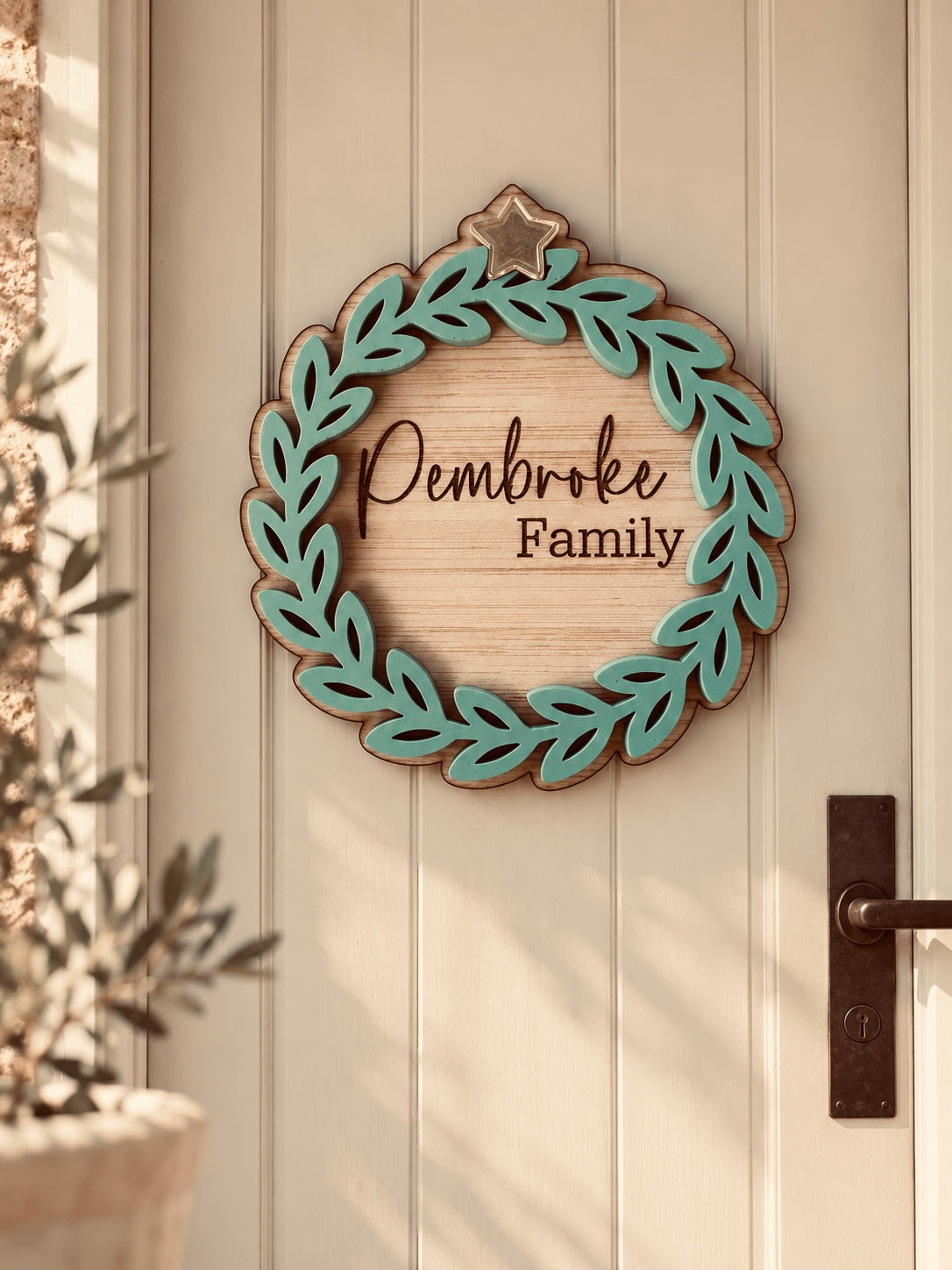Coco & May personalised family Christmas door wreath with family name and layered leafy design