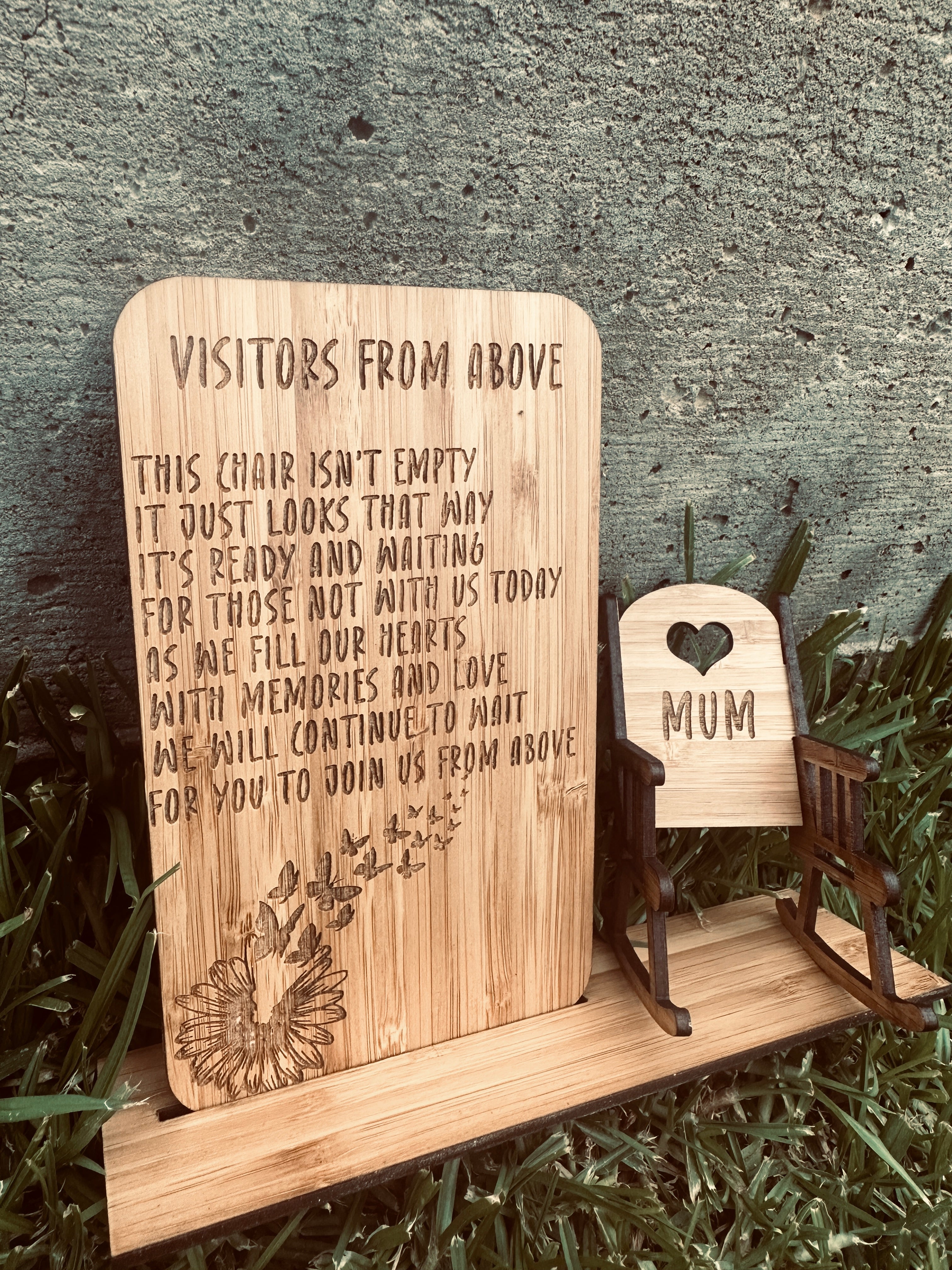 Visitors from above memorial plaque wooden remembrance sign